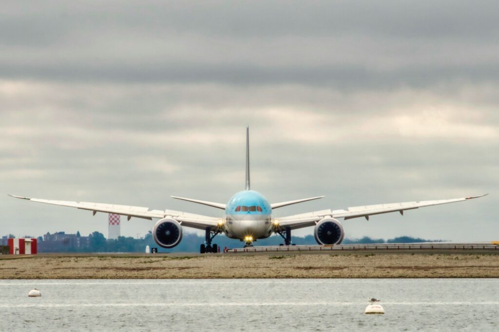 a large jetliner sitting on top of an airport runway