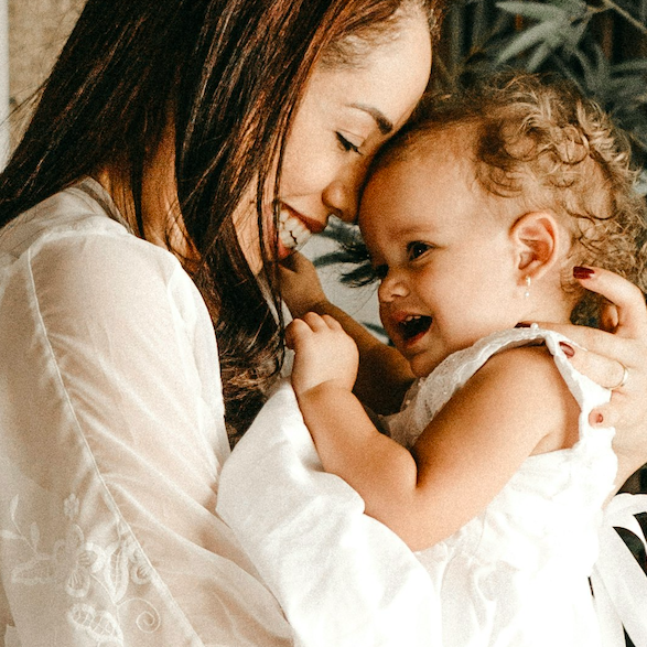 A mother holding a baby