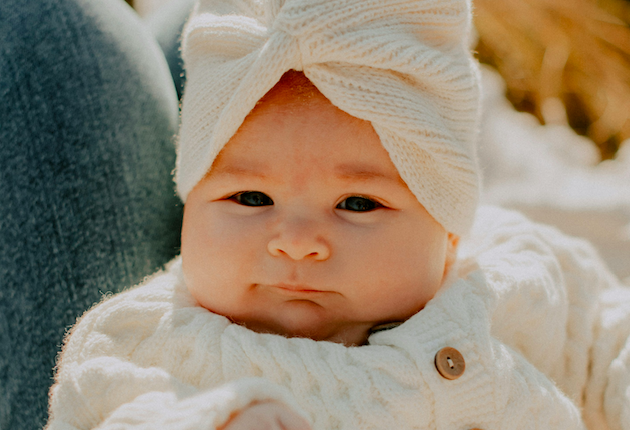 Baby in knit hat and sweater