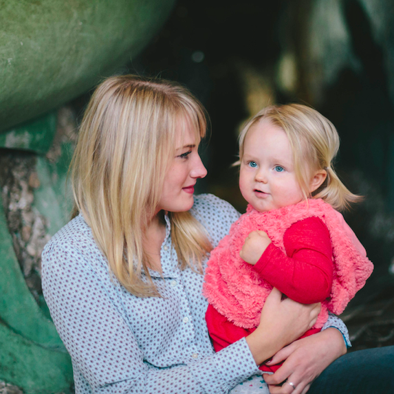 Mother holding baby daughter