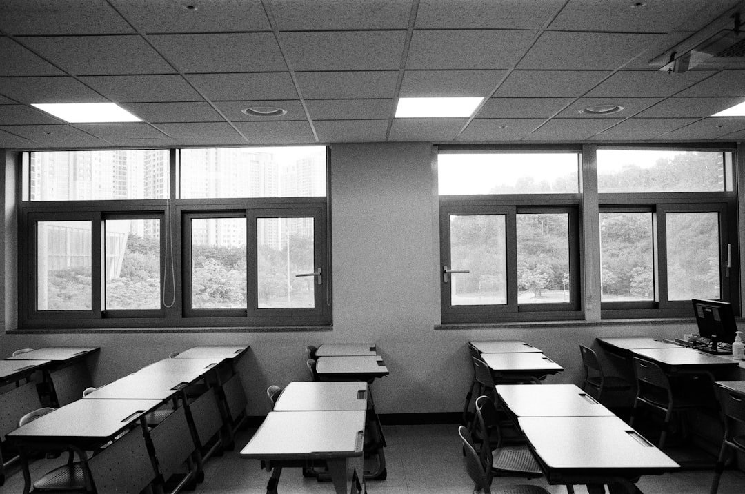 A black and white image of a classroom.

