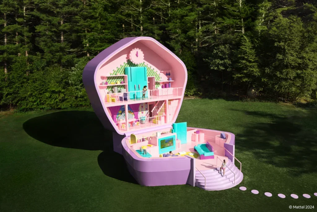 A life-size Polly Pocket surrounded by green grass and trees
