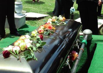 group of people attending burial