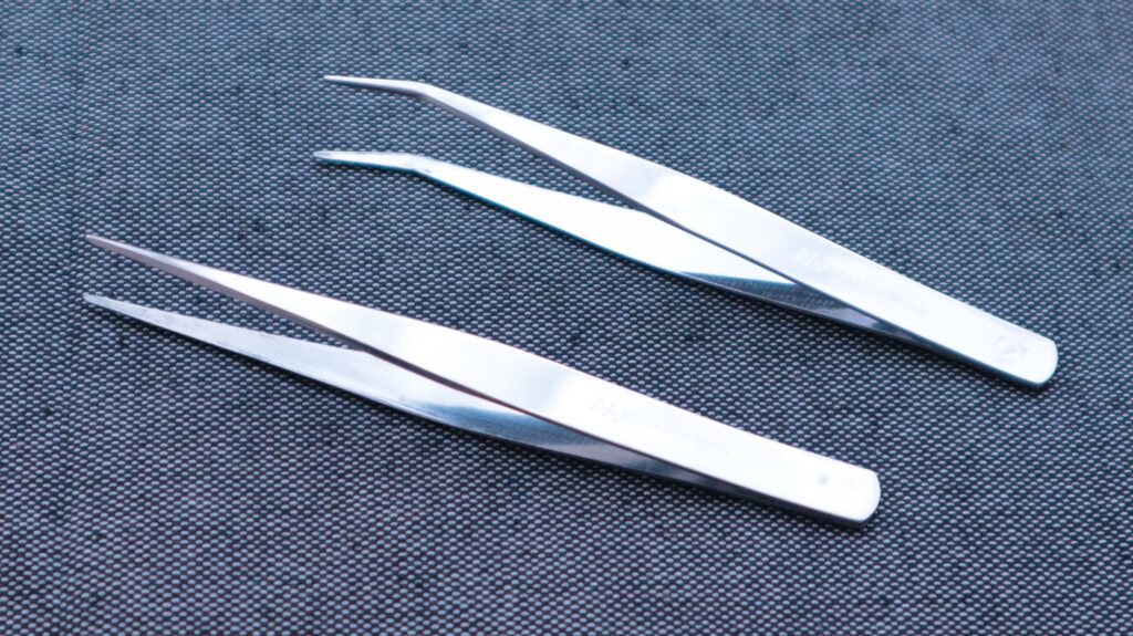 Two tweezers side by side 
