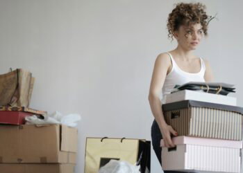 woman holding moving boxes