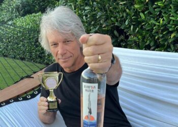 Jon Bon Jovi holding up alcohol