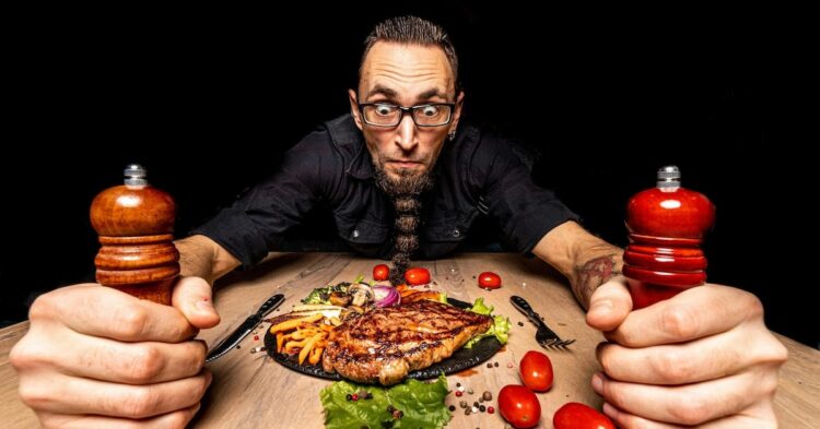 man looking mad at a dinner table