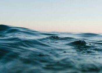 body of water under sky