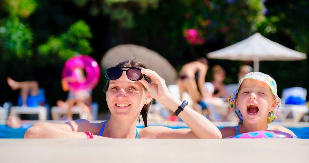 a woman and a child at the pool