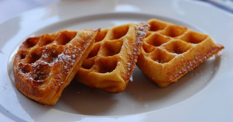 three waffles on a white plate