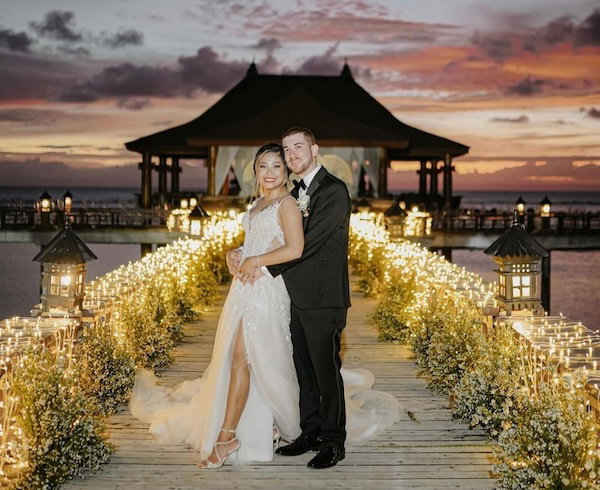 Drew Binksy and wife at their wedding in the Philippines