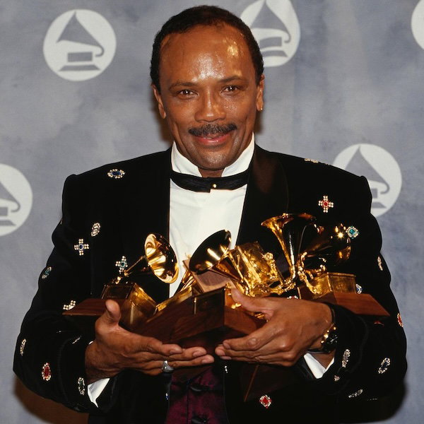 Quincy Jones holding his Grammys