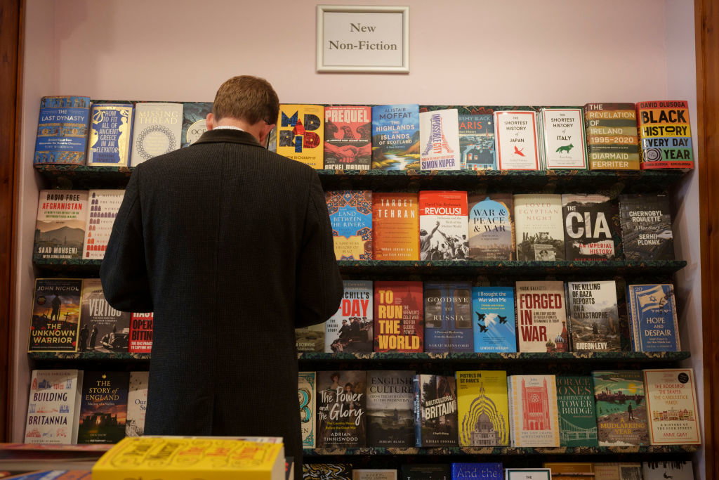 Bookshop Customer Browses Non-fiction Titles