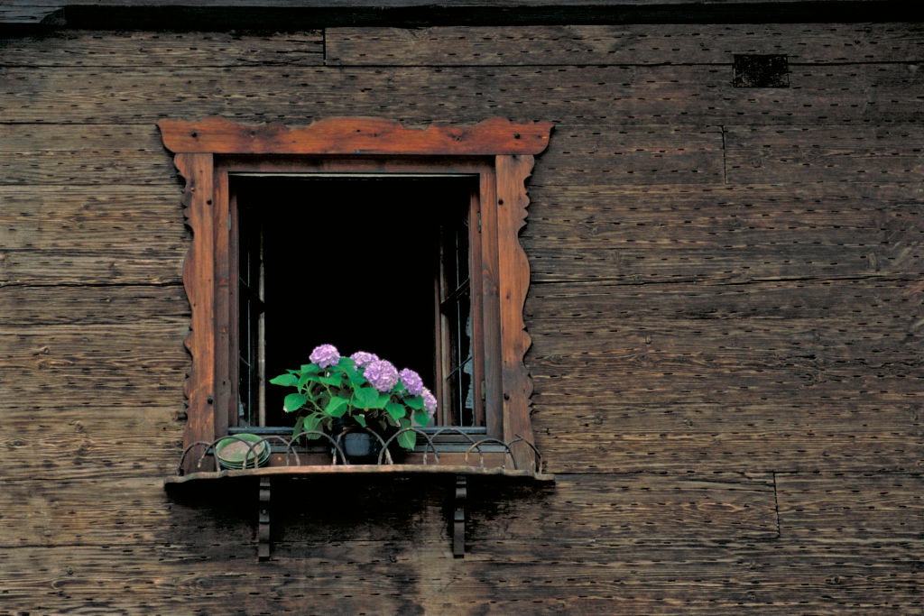 Oberammergau Passion Play Bavaria Germany Europe open window of a wood sided house with flowers