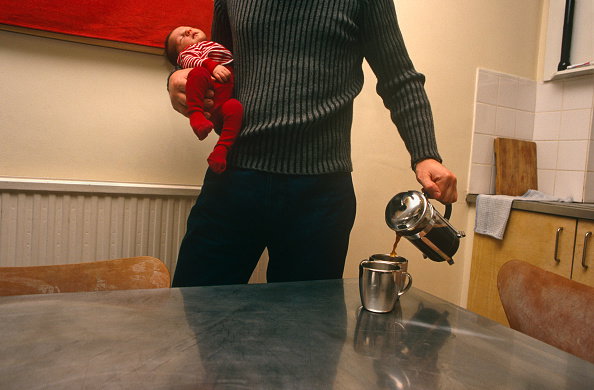 England - London - Father left holding baby