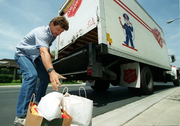 AA.rags.army.bags.0501.AAGRick Core, a driver with the Salvation Army, picks up bags of donated cl