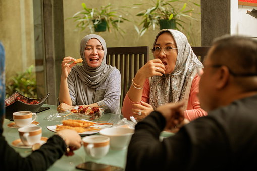 happy asian friends having iftar together