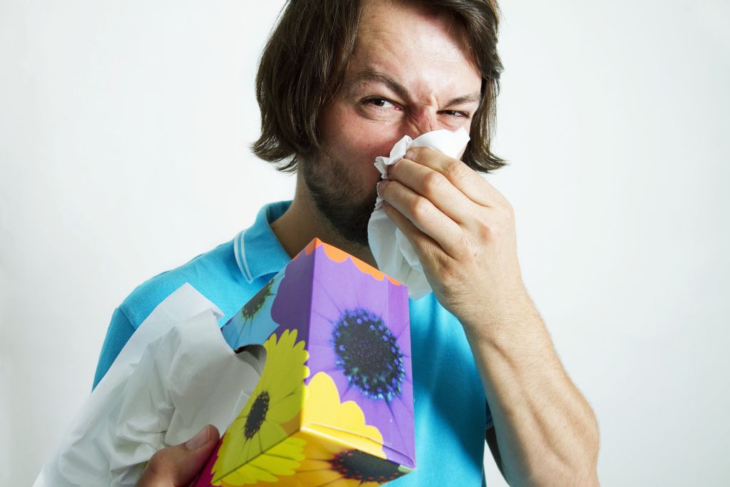 Man blowing his nose