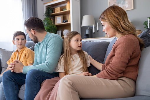 Family in a serious conversation at home