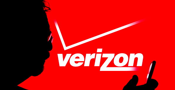 In this photo illustration, a Verizon Communications logo...