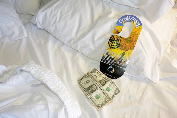 A tip on a bed in the Crowne Plaza Jacksonville Riverfront hotel.