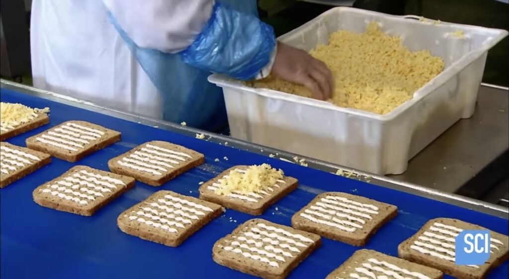 Workers adding sandwich fillings