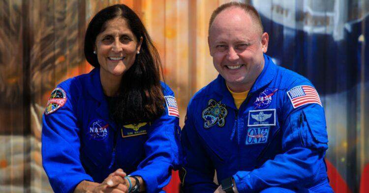 NASA astronauts Suni Williams, left, and Mike Fincke, right, pose for photographs while visiting NASA’s Kennedy Space Center in Florida, May 18, 2022, in advance of the agency’s Boeing Orbital Flight Test-2 (OFT-2) for NASA’s Commercial Crew Program.