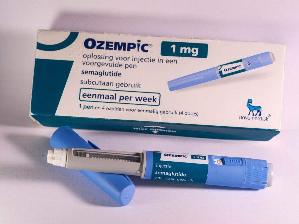 A tube of oezpic sitting next to a tube of oezpic