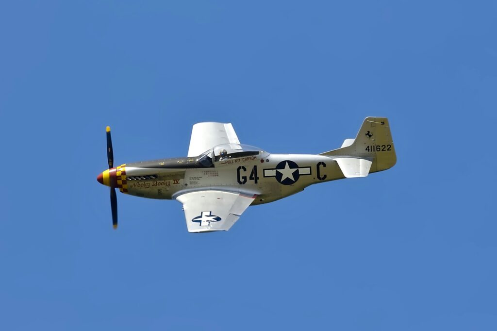 white and green jet plane