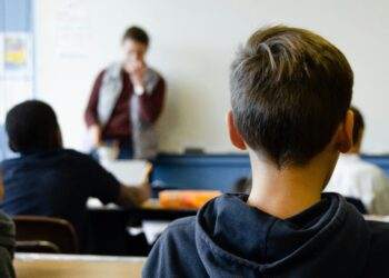 Children in class with focus on one boy