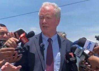 Senator Van Hollen talking to the press
