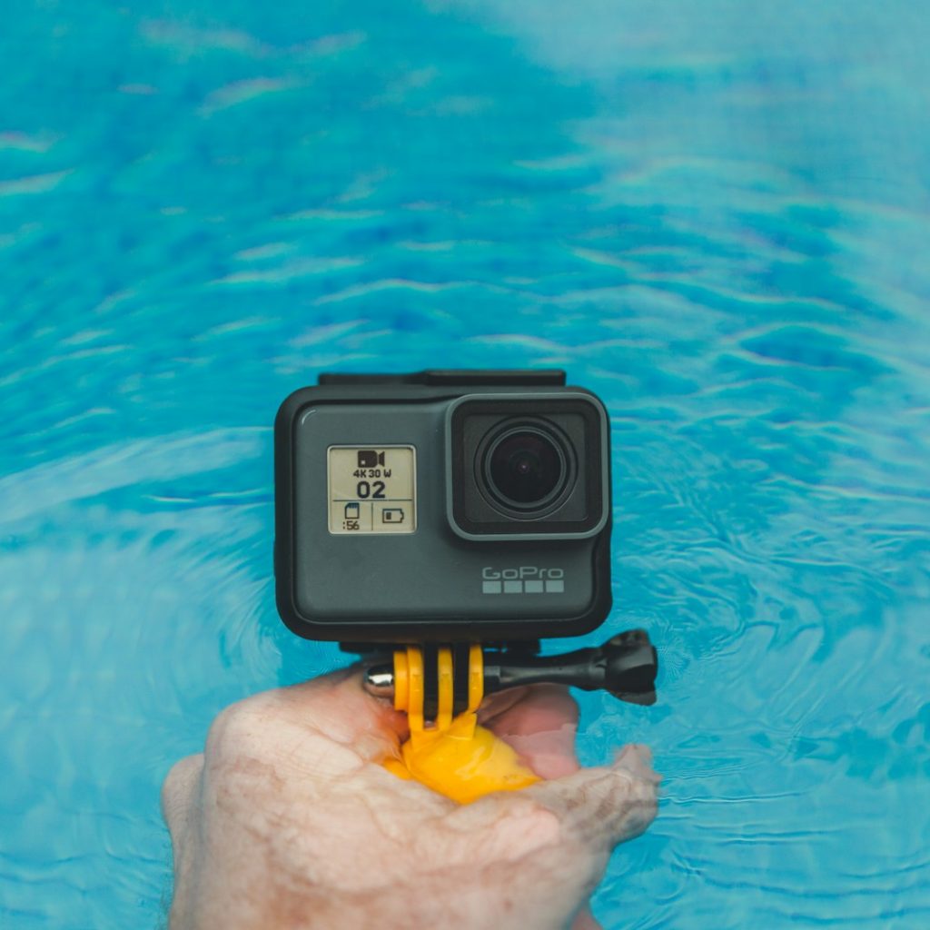 person holding GoPro HERO