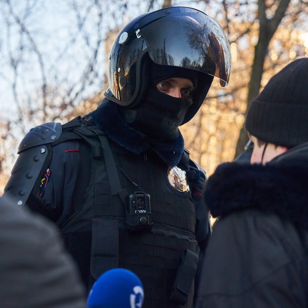 man in black jacket wearing helmet