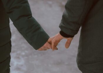 Man and woman holding hands