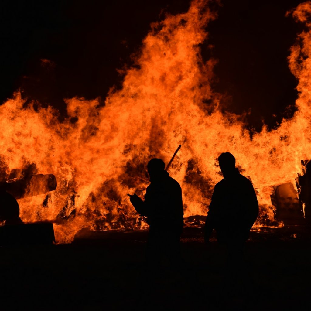 people walking near fire