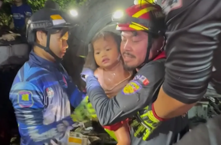 Rescuers saving baby girl from crash in Thailand (Thairath TV / AP)