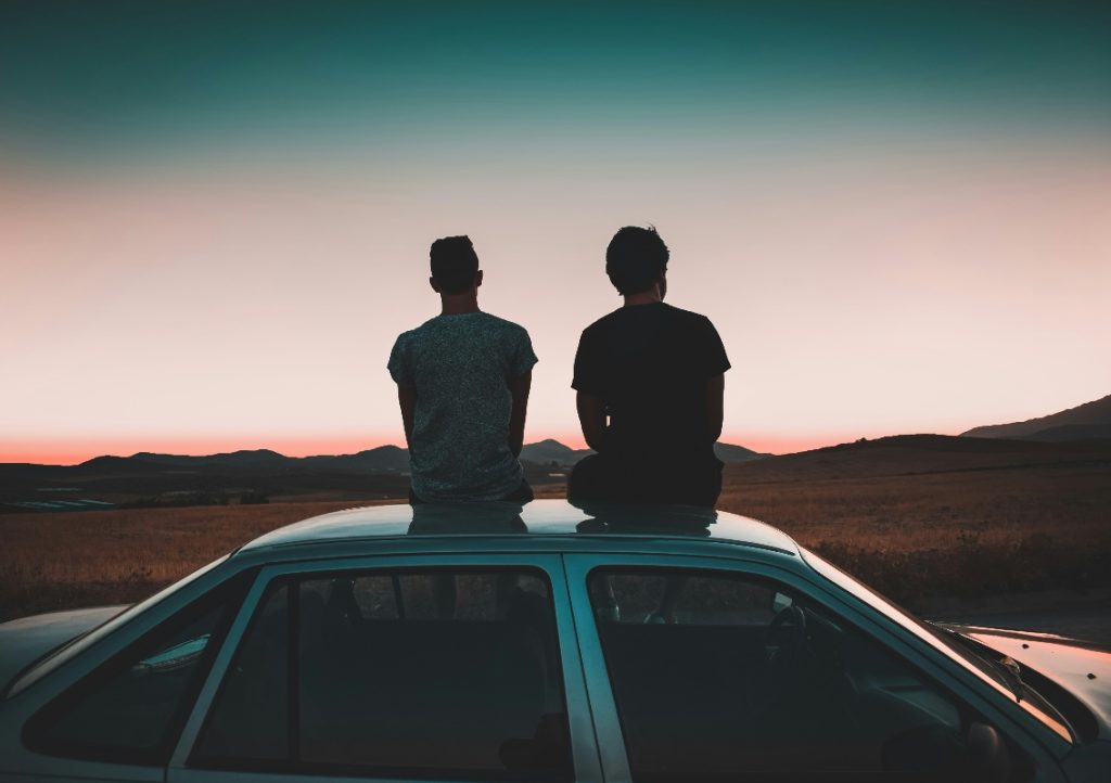 Brothers watching sunset