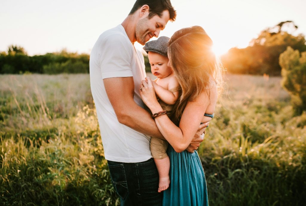 Family standing in field