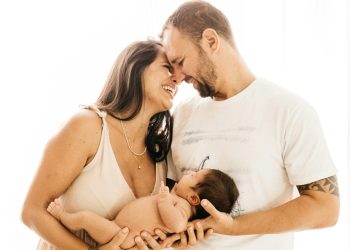 Parents holding baby
