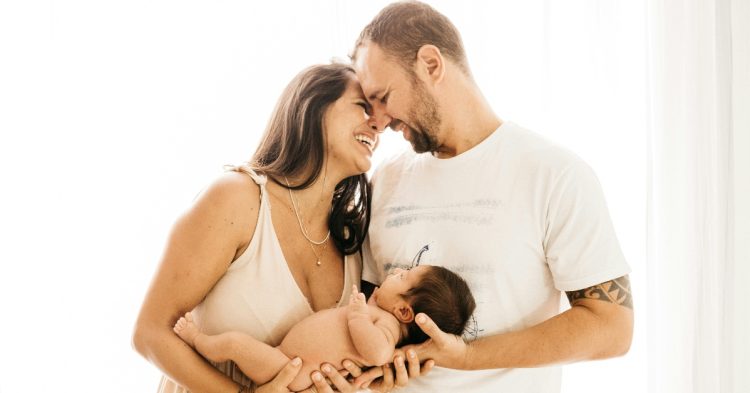 Parents holding baby
