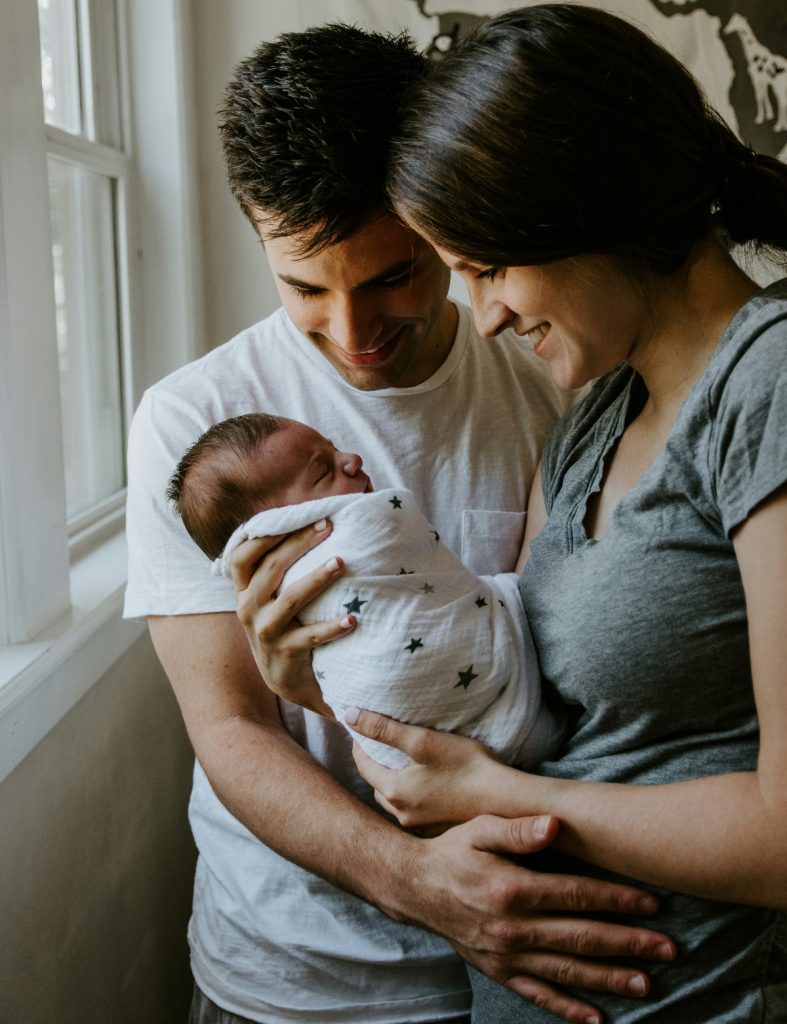Parents holding baby