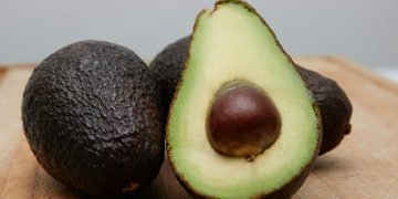Ripe avocado open in half