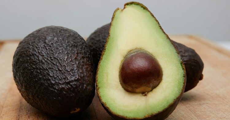 Ripe avocado open in half