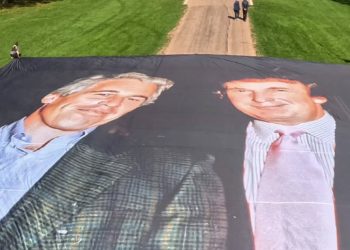 Banner on Windsor Castle footway showing Trump and Epstein