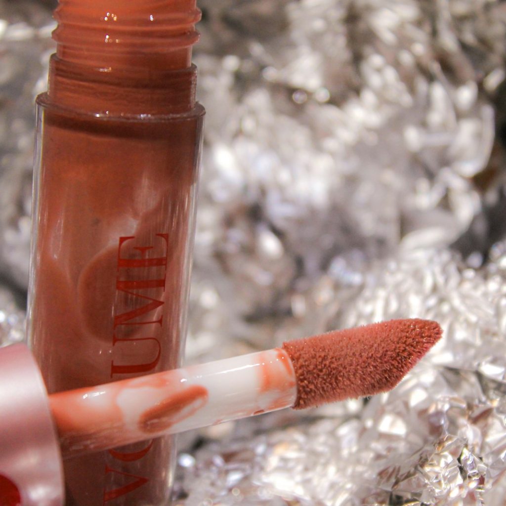 a close up of a lipstick on a piece of tin foil