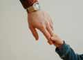 Father and son holding hands