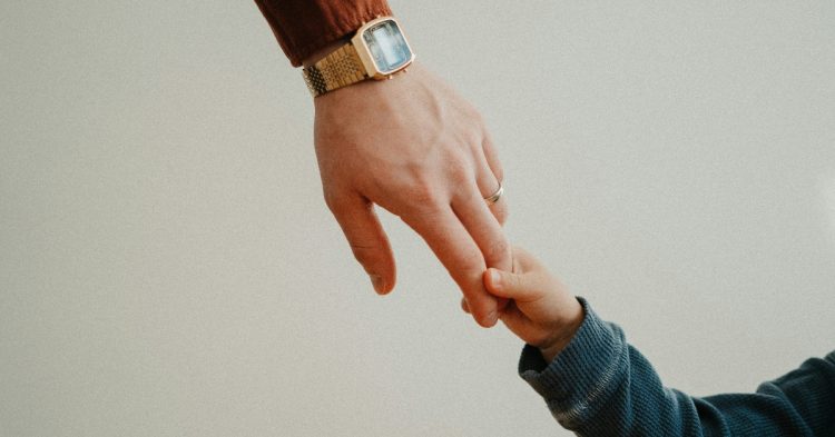 Father and son holding hands
