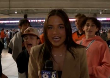 KEZI reporter being taunted by football fans