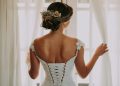 Bride looking out window