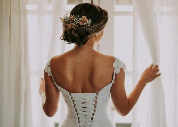 Bride looking out window